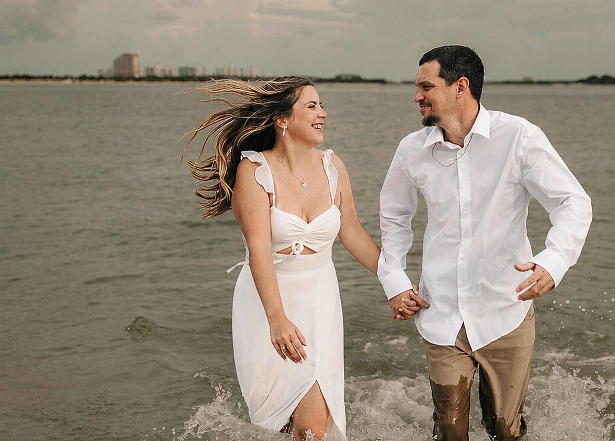 Heather and William walking through shallow water